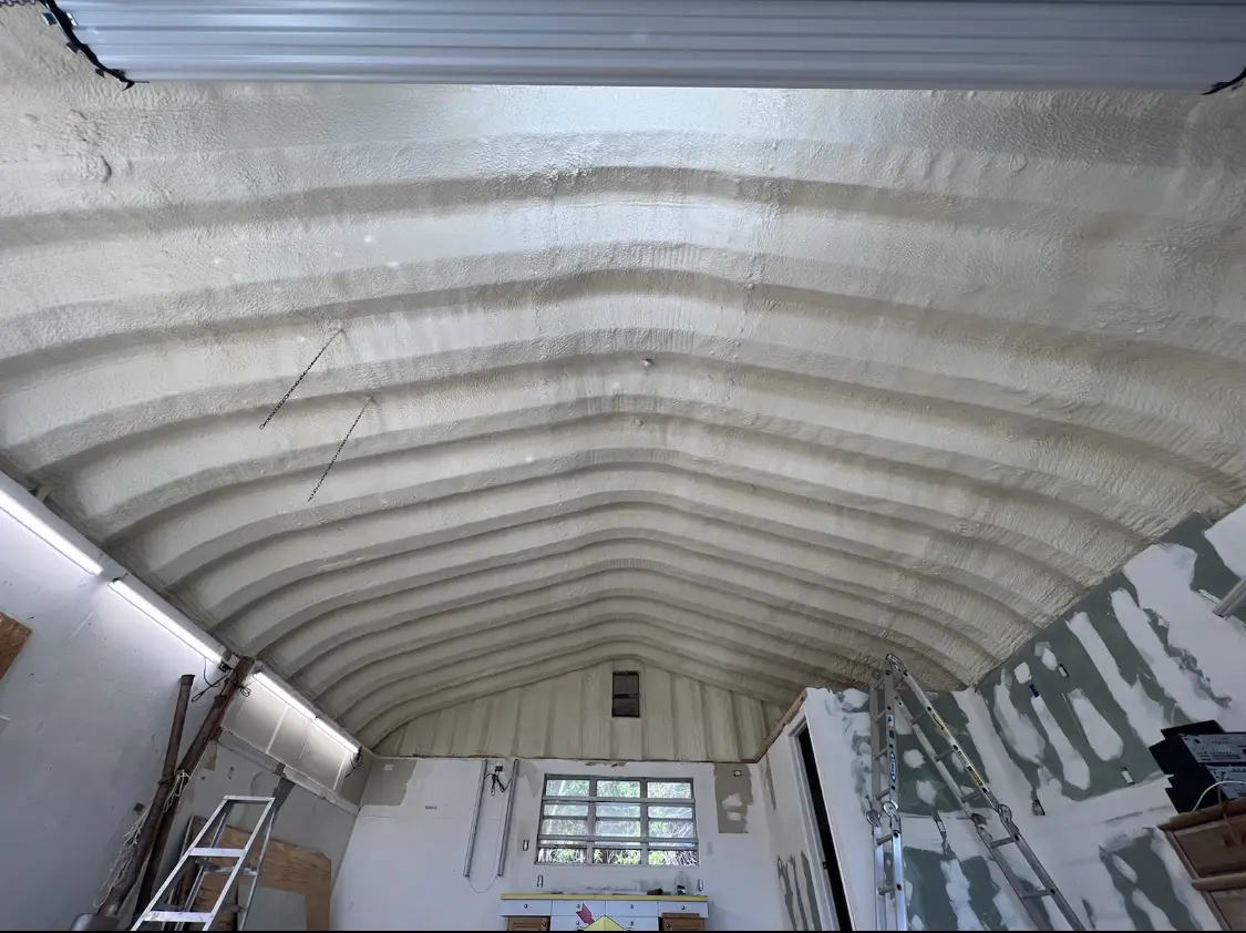 Spray polyurethane foam applied to the underside of a metal roof deck in Mecca