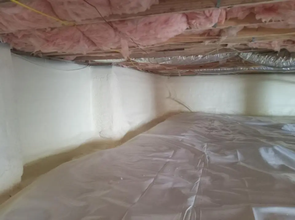 Crawl space encapsulation with closed-cell spray foam for Commercial Roof Restoration in Mecca
